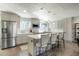 Modern kitchen with stainless steel appliances, quartz countertops, and ample cabinet space at 2254 S Eagle St, Aurora, CO 80014