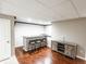 Finished basement with a bar area and a rustic cabinet at 6686 Solana Dr, Castle Pines, CO 80108