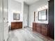 Modern bathroom featuring dual vanities, tiled floors, and ample space for comfort and convenience at 6686 Solana Dr, Castle Pines, CO 80108