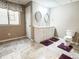 Bright bathroom features a double vanity and tile flooring at 6686 Solana Dr, Castle Pines, CO 80108