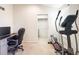 Functional office space with desk, chair, and workout equipment for a balanced work-life at 6686 Solana Dr, Castle Pines, CO 80108