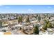 A winter aerial shot showcasing homes in a community neighborhood with views of the surrounding mountains at 13131 Mercury Dr, Lone Tree, CO 80124