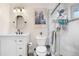 Updated bathroom featuring a modern vanity, glass-enclosed shower, and stylish fixtures at 13131 Mercury Dr, Lone Tree, CO 80124