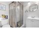 Bathroom featuring shower, toilet, framed art, circular mirror and vanity at 13131 Mercury Dr, Lone Tree, CO 80124