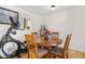 Dining area with hardwood floors and a pass-through to the kitchen at 13131 Mercury Dr, Lone Tree, CO 80124