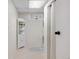 Laundry room featuring a stacked washer/dryer and shelving for storage at 13131 Mercury Dr, Lone Tree, CO 80124