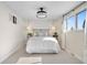 Bright main bedroom with carpet, featuring natural light and modern hanging light fixtures at 13131 Mercury Dr, Lone Tree, CO 80124