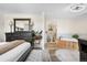 Large main bedroom boasting a decorative wood bed frame, a wooden soaking tub, and access to the bathroom at 13131 Mercury Dr, Lone Tree, CO 80124