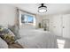 Cozy main bedroom with carpet, featuring natural light and a comfortable bed with stylish pillows at 13131 Mercury Dr, Lone Tree, CO 80124