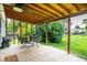 Inviting back porch featuring an outdoor ceiling fan with a table and chairs perfect for entertaining at 11886 Birch Dr, Thornton, CO 80233