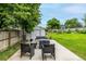 Relaxing backyard patio with stylish seating, a storage shed, and a lush green lawn for outdoor enjoyment at 11886 Birch Dr, Thornton, CO 80233