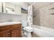 Cozy bathroom with tiled shower and tub, updated vanity, and efficient layout at 11886 Birch Dr, Thornton, CO 80233