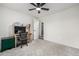 Neutrally decorated bedroom featuring updated ceiling fan and natural light at 11886 Birch Dr, Thornton, CO 80233
