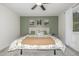 Cozy bedroom featuring neutral tones, a ceiling fan, artwork, and a plush bed at 11886 Birch Dr, Thornton, CO 80233