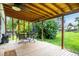 Outdoor deck space featuring a dining table with chairs, offering a relaxing area overlooking the backyard at 11886 Birch Dr, Thornton, CO 80233