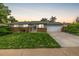 Charming single-story home with a well-manicured lawn, brick accents, and an attached two-car garage at 11886 Birch Dr, Thornton, CO 80233