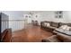 Open-concept living area with hardwood floors, comfortable sofa and a view to the dining area at 11886 Birch Dr, Thornton, CO 80233
