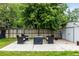 Patio area with seating around a fire pit, perfect for entertaining in the backyard at 11886 Birch Dr, Thornton, CO 80233