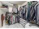 Spacious walk-in closet provides ample storage with built-in shelving and hanging rods at 11886 Birch Dr, Thornton, CO 80233