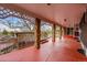 Outdoor back porch area with decorative support beams and an upper deck area at 11157 W Marlowe Ave, Jefferson, CO 80127