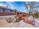 Spacious backyard with a well, rock garden, brick patio and a deck area, perfect for outdoor entertaining at 11157 W Marlowe Ave, Jefferson, CO 80127