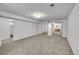 Carpeted basement space with a mirrored closet and doorway to another room at 11157 W Marlowe Ave, Jefferson, CO 80127