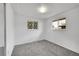 Empty bedroom with carpeted floors, two windows and neutral walls at 11157 W Marlowe Ave, Jefferson, CO 80127