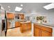 Modern kitchen with stainless steel appliances, granite countertops, and center island at 11157 W Marlowe Ave, Jefferson, CO 80127