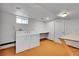 Laundry room with white washer/dryer, utility sink, work area and a window at 11157 W Marlowe Ave, Jefferson, CO 80127