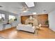 Living room with a brick fireplace, hardwood floors, a ceiling fan and lots of natural light at 11157 W Marlowe Ave, Jefferson, CO 80127