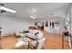 Bright living room featuring hardwood floors, a ceiling fan and lots of natural light at 11157 W Marlowe Ave, Jefferson, CO 80127