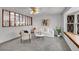 Bright living room with a plush carpet, a comfortable sofa, and a large window at 11157 W Marlowe Ave, Jefferson, CO 80127