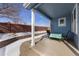 Covered back patio with outdoor seating and landscaped yard that offers space for relaxing or entertaining at 13151 Ivanhoe St, Thornton, CO 80602