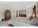 Comfortable bedroom with a ceiling fan, complemented by stylish furnishings and an ensuite bathroom at 13151 Ivanhoe St, Thornton, CO 80602