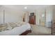 Bright bedroom featuring carpet flooring, a ceiling fan, and access to the ensuite bathroom at 13151 Ivanhoe St, Thornton, CO 80602