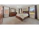 Comfortable bedroom with a large window and a traditional dresser at 13151 Ivanhoe St, Thornton, CO 80602