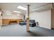 Spacious finished basement with a sectional couch, carpeted flooring, and wood panel accents at 4693 Chatham St, Boulder, CO 80301