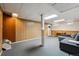 Versatile finished basement featuring carpeted floors, wood paneling, and a functional layout at 4693 Chatham St, Boulder, CO 80301