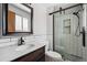 Updated bathroom featuring a modern vanity, subway tile, and a glass-enclosed shower with black hardware at 4693 Chatham St, Boulder, CO 80301