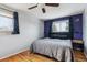 Comfortable bedroom featuring hardwood floors, dual windows, and modern decor for a relaxing atmosphere at 4693 Chatham St, Boulder, CO 80301