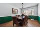 Elegant dining room with a wooden table, upholstered chairs, and hardwood floors at 4693 Chatham St, Boulder, CO 80301