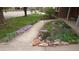 Landscaped front yard featuring a stone lined flower bed and sidewalk leading up to the brick home at 4693 Chatham St, Boulder, CO 80301