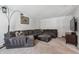 Cozy living room featuring a gray sectional sofa, plush carpeting, and a decorative lamp at 4693 Chatham St, Boulder, CO 80301