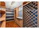 Charming wine cellar with wooden racks, storage cabinets, and space for wine glasses at 4693 Chatham St, Boulder, CO 80301