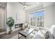 Inviting living room with fireplace, large window, and contemporary furnishings at 3481 W 63Rd Ave, Denver, CO 80221