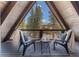 Balcony with mountain views and outdoor seating to enjoy the scenery at 297 Robertson Ln, Breckenridge, CO 80424