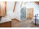 Bright bathroom featuring a glass enclosed shower and free standing tub at 297 Robertson Ln, Breckenridge, CO 80424