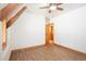 Open bedroom with hardwood floors, wooden trim, and a barn door entrance, creating a cozy and inviting space at 297 Robertson Ln, Breckenridge, CO 80424
