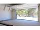 Spacious garage with an open door revealing a picturesque view of the lush, green forest at 297 Robertson Ln, Breckenridge, CO 80424
