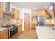 Kitchen features stainless steel appliances, custom cabinets, and wood floors at 297 Robertson Ln, Breckenridge, CO 80424